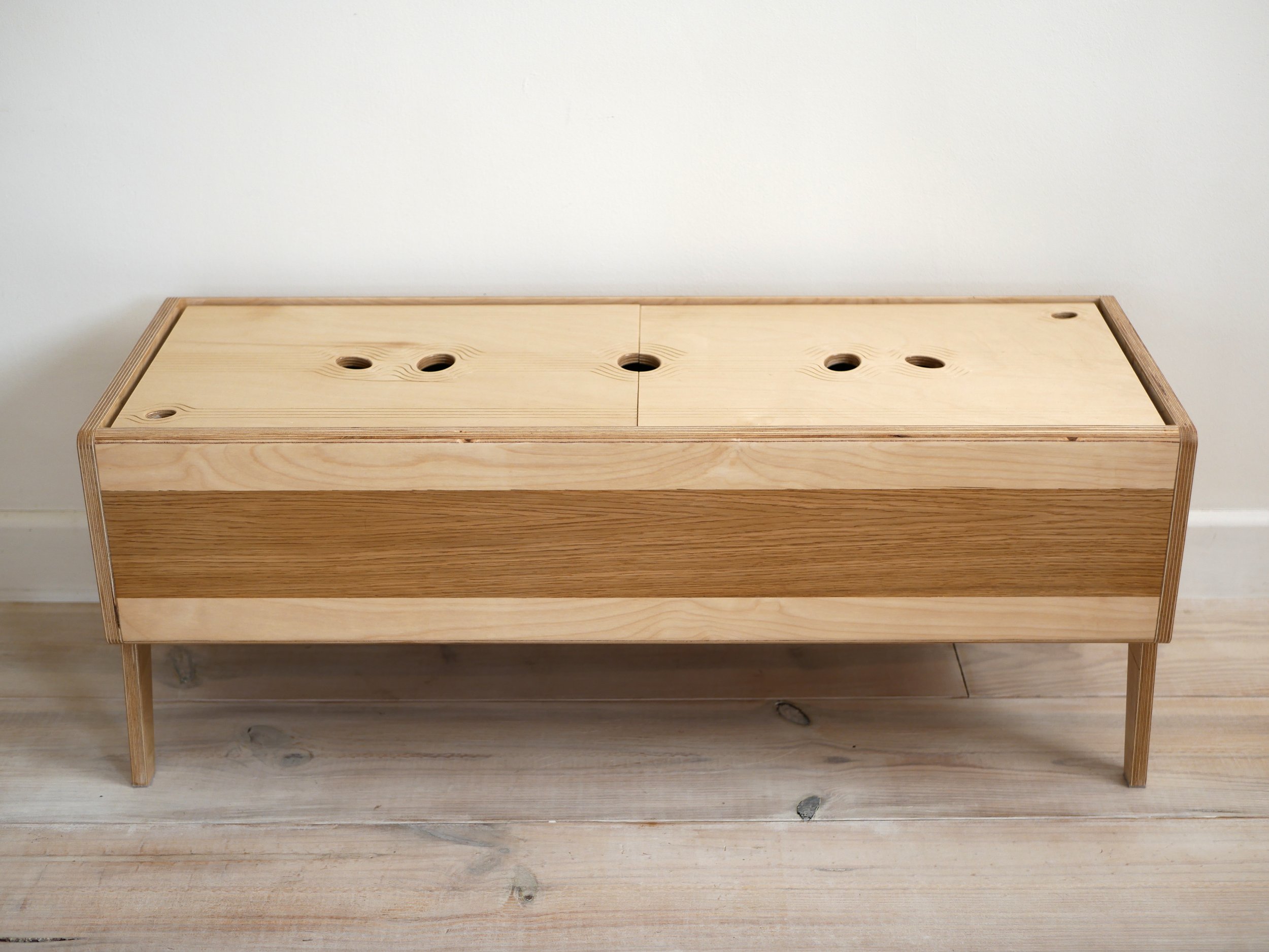 Illuminated plywood low storage unit